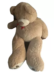 Giant Stuffed Teddy Bear. About 60 inches longRed Bow around neck