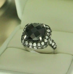 Black CZ in the center surrounded by a clear CZ halo. Sterling silver with black plating.