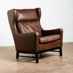 Outstanding top grain brown leather wingback lounge chair. This chair looks amazing from any side and is even more...