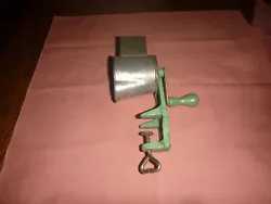 Wood green handle, steel and cast iron and wood. Good green paint, still workin condition, no splits in wood handle....