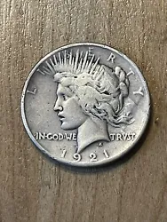 1921 Peace Dollar F. Attractive key date coin with sharp hair detail and sharp wing feathers showing in eagle. Coin has...