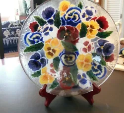 Colorful fused glass serving bowl featuring a riot of cheerful pansies. Designed by Peggy Karr in the 1990s and made in...