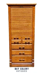 The cabinet has 4 paneled sides with shallow carvings on the panels. The key and the escutcheon plate were hidden in a...