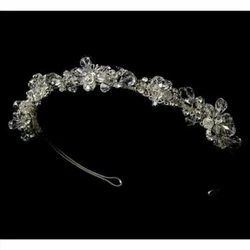 Silver color tiara. Thischarming filigree headband dazzles with tear shaped Swarovski crystals and rhinestones arranged...