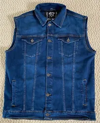 Color: Stonewash Blue. Nathan Denim Vest. The vest is a classic denim trucker vest in blue stretch denim. It buttons...
