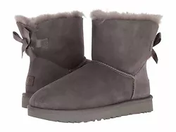 Style #: 1016501. Leather heel label with embossed UGG® logo. Treadlite by UGG™ outsole. Style: Mini Bailey Bow II....