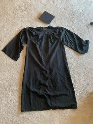 In like-new condition. Black. Includes cap and gown. Free shipping!