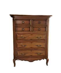 You can see the dowel details on the top. The mirror has an amazing cut-out detail on the top. Triple dresser L63