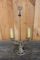 For sale is this antique double candle electric lamp.