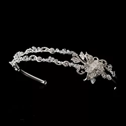 This charming silver clear crystal flower headpiece features a stunning silver plated flower design adorned with...