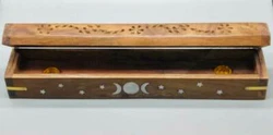A unique decorative box to burn your favorite incense in. This is a carved box with silver toned stars and a triple...