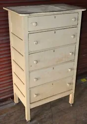 Full board construction. It is in good condition other than needing to be resurfaced. The 5 drawers were manufactured...