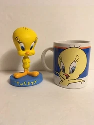 Tweety Bird bobble head in very good condition. There is a small nick in base. Shown in the photo. Tweety Bird mug with...