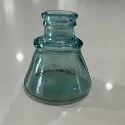 This antique blue glass ink bottle is a unique addition to any collectors collection. The wobbly and warped design of...