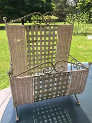 The basket is made out of wicker and brass. There is one area where the wicker is punctured but it does not affect the...