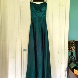 Witness of Love Satin DressEmerald greenCorset backHidden zipperElastic around back above zipperSide slit from waist to...