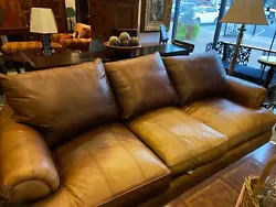 Features rolled arms and paneled seats and cushions. Featured rounded wooden legs. No on-site help will be available. A...