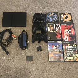 Sony PlayStation 2 Slim Charcoal Black Console Bundle Games And Controllers. Good condition. Works. Comes with cords...