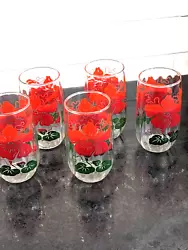 5 glasses. 4.75 in tall, marked on bottom, Beveled like glass. Two shades of red ombre and dark green.