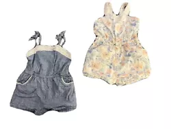 Baby girl romper set, size 12 months. One romper is blue. There is lace trim on top of romper and lining the pockets in...
