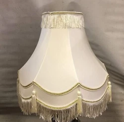 Faux Silk Fabric Cream Lamp Shades with Gold trim at the top and bottom.