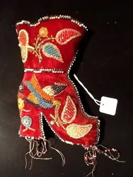 Beaded flowers and bird - beading in excellent condition on boot. Velvet front in very good condition.