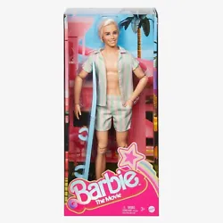 • He looks as easy and breezy as film Ken with his surfboard, platinum blond hair, unbuttoned top, and white...