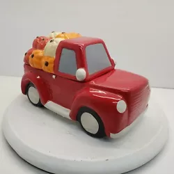 Earthenware Cookie Jar Red Pickup Truck With Pumpkins. This is a cute little cookie jar in good pre-owned condition. It...
