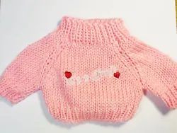 This acrylic blend, knit embroidered sweater will fit just about any doll, plush or stuffed animal from 8