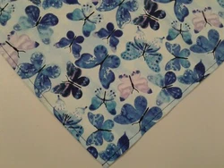 Custom made blue dog bandana with butterflies. This is atie on dog bandana. Pattern: blue and pink butterflies. All...