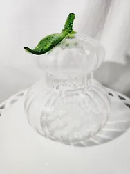 This Italian Venetian clear glass gourd apothecary jar with a green leaf design is a unique and beautiful addition to...