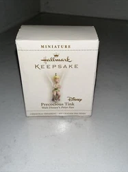 Add some magic to your Christmas tree with this Hallmark miniature ornament featuring Tinker Bell. The fairy-shaped...