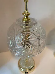 This beautiful table lamp is in excellent condition with no damage. The light works as it should. Stands about 12