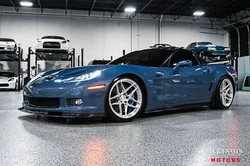 ZR1 carbon fiber components includes roof, roof bow, front splitter. and rocker extension with visible clear-coated...