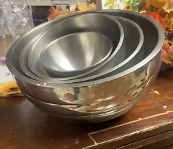 Set of 4 stainless steel mixing bowls. Used. See photos. One has a dent on the outside.