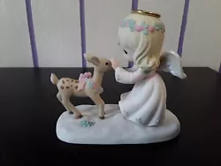 Angel feeding deer. Excellent condition box is in good condition.