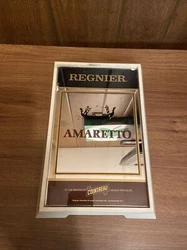 Elevate your home bar collection with this vintage Regnier Amaretto display mirror. Crafted with a high level of...