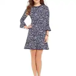 Seems to be Wrinkle resistant. Machine Wash ColdRuffle accents, A-Line Silhouette, Crew Neckline, Animal Print, Knee...