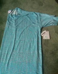 This is a BNWT LuLaRoe 2xl Irma. It is light blue with micro polka dots in white, orange, & pink. It is 96% polyester,...
