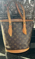 Louis Vuittoin Bucket Bag in Fair condition, Some visible cosmetic flaws on the edge of the seam, such as a wear hole...
