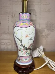 This antique Chinese vase is a stunning piece of art that has been transformed into a lamp. The intricate details and...