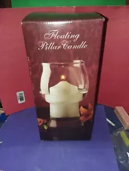 The pillar candle is sizable at nearly 11 oz and is scented pina colada. It is all in its original box.