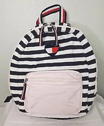 The bag features an embroidered heart logo on a navy, white, and pink cotton exterior.