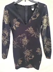 Shiny Gold Floral Design. Long Sleeve. Condition: Excellent. NO holes, tears, stains. Very minimal wear. Back Zipper.