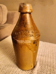 This vintage ceramic beer bottle from Newton & Co is a rare find for any collector. The bottle measures 10.5 inches...