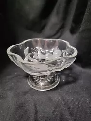 This charming glass candy dish from Mikasa features a delightful cherub pattern in clear and frosted glass. The round...