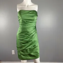Davids Bridal bridesmaid/prom dress in green is strapless with pleated gathers. Back zip closure, fully lined with...