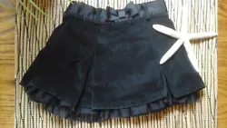 Excellent condition. It has a velvety texture. Lined and a sweet Toille trim. Elastic waist with a ribbon/bow. Size 2...