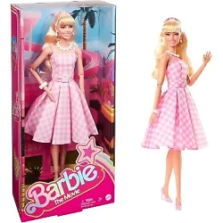•Take home a part of Barbie The Movie with this collector Barbie doll! Wearing a pink gingham dress, she’s all set...