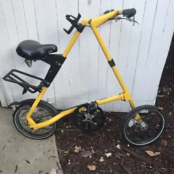 Strida Folding Bike Yellow. Normal signs of use and wear, the seat has some minor cosmetic damage, please see photos....